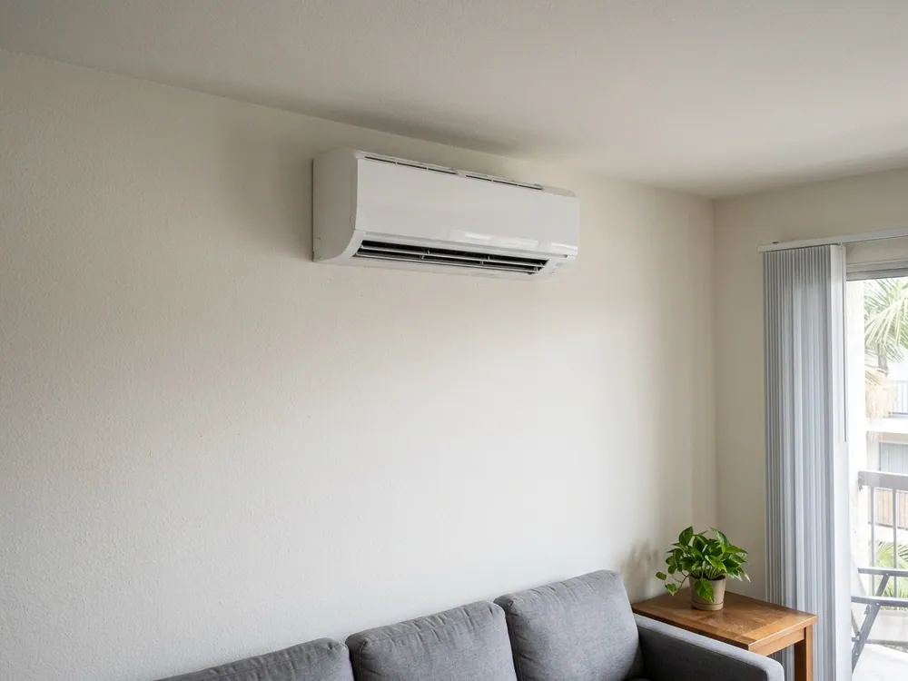 Indoor mini-split above condo seating.