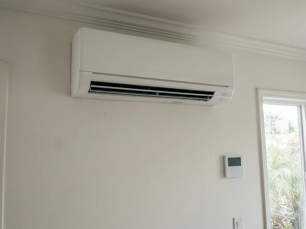Indoor mini-split and a plain wall controller.